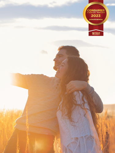 A couple take a photo, a banner on the top right reads Consumer Choice Award 2023 Saskatchewan